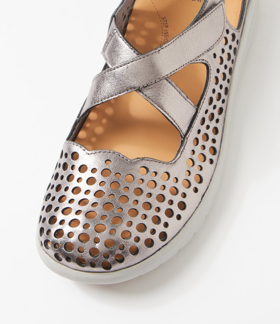 Ziera Sachet closed-toe shoe in pewter leather with floral cutout detailing, breathable design, cushioned footbed, and low-profile sole on a white background