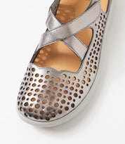 Ziera Sachet closed-toe shoe in pewter leather with floral cutout detailing, breathable design, cushioned footbed, and low-profile sole on a white background