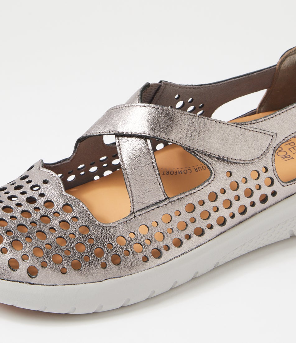 Ziera Sachet closed-toe shoe in pewter leather with floral cutout detailing, breathable design, cushioned footbed, and low-profile sole on a white background