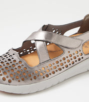 Ziera Sachet closed-toe shoe in pewter leather with floral cutout detailing, breathable design, cushioned footbed, and low-profile sole on a white background