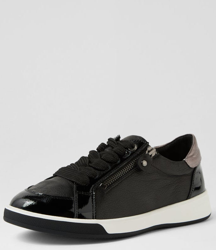 Black sneaker with a white sole on a light gray background