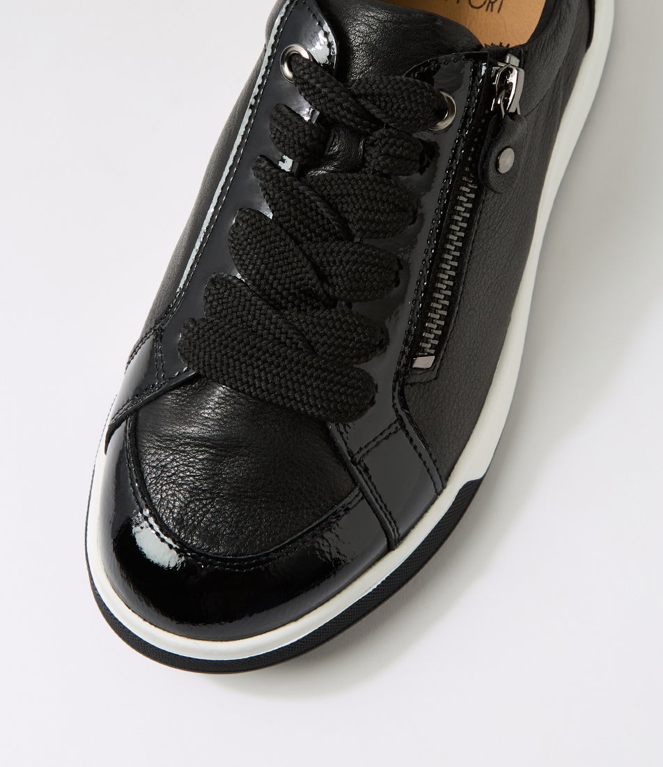 Black sneaker with a zipper on a white background