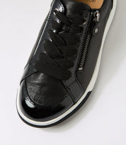Black sneaker with a zipper on a white background