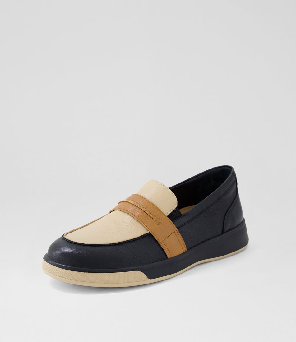 Loafer shoe with black, beige, and brown color scheme on a light gray background