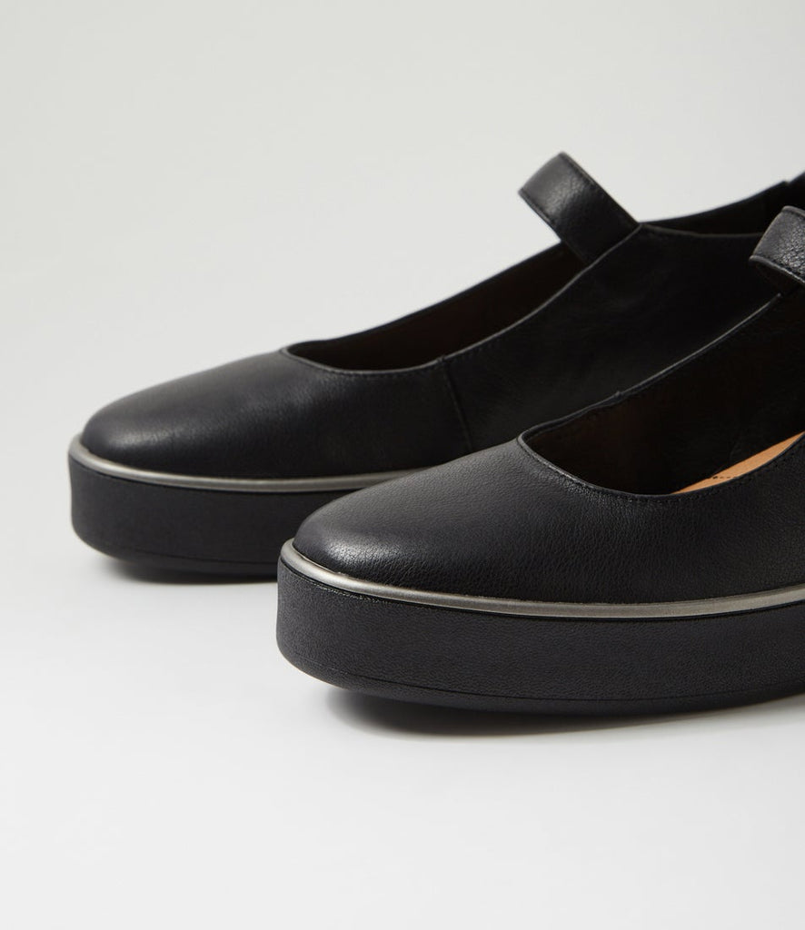 Ziera Zufan casual Mary Jane shoe in black leather with adjustable strap, rounded toe, cushioned footbed, and black supportive sole on a white background