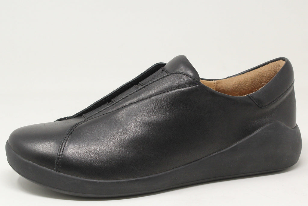 Black leather slip-on shoe on a white background