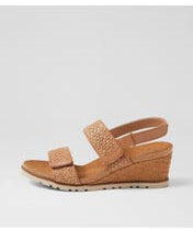 Ziera Kift wedge sandal in coffee-toned raffia with adjustable straps, cushioned footbed, and mid-height wedge sole on a white background