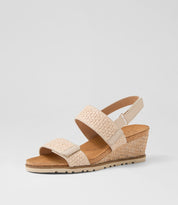 Ziera Kift wedge sandal in natural-toned raffia with adjustable straps, cushioned footbed, and mid-height wedge sole on a white background