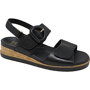Black sandal with a buckle on a white background