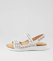 White sandal with wooden sole on a light gray background
